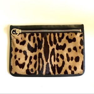 Alexander Wang leather pouch with animal print.